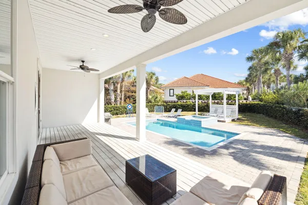a en suite bathroom with a granite countertop sink and a mirror