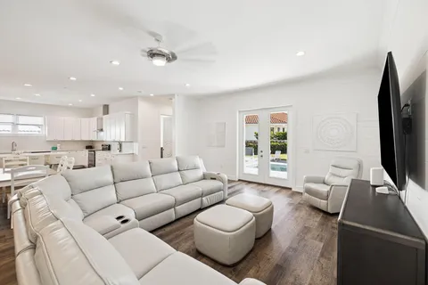 a view of living room with furniture and wooden floor