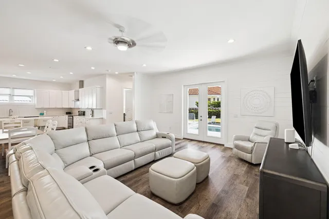 a view of living room with furniture and wooden floor