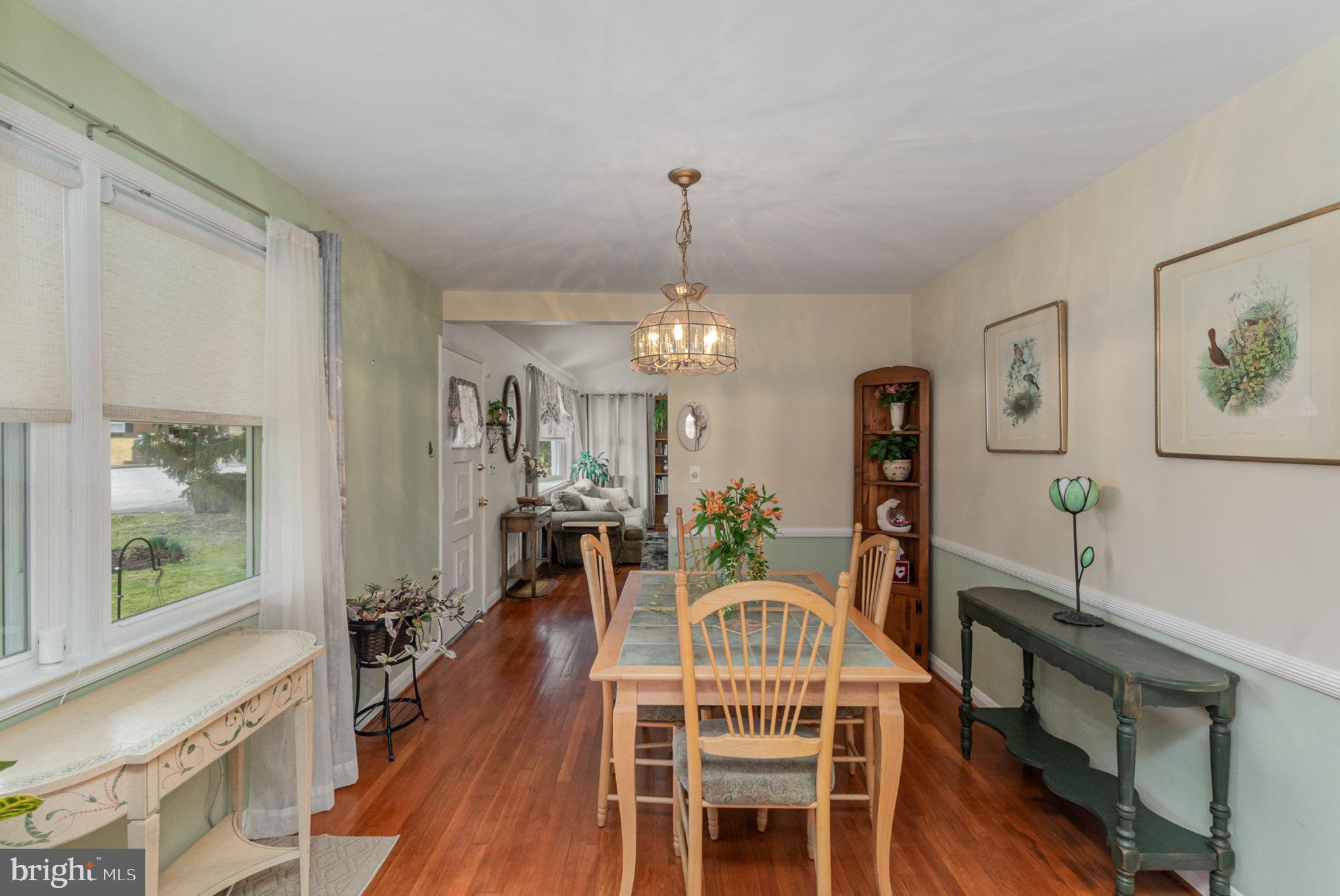 1406 Shefford Road Baltimore, MD 21239 - Photo 7 of 33 a view of a dining room with furniture window and wooden floor