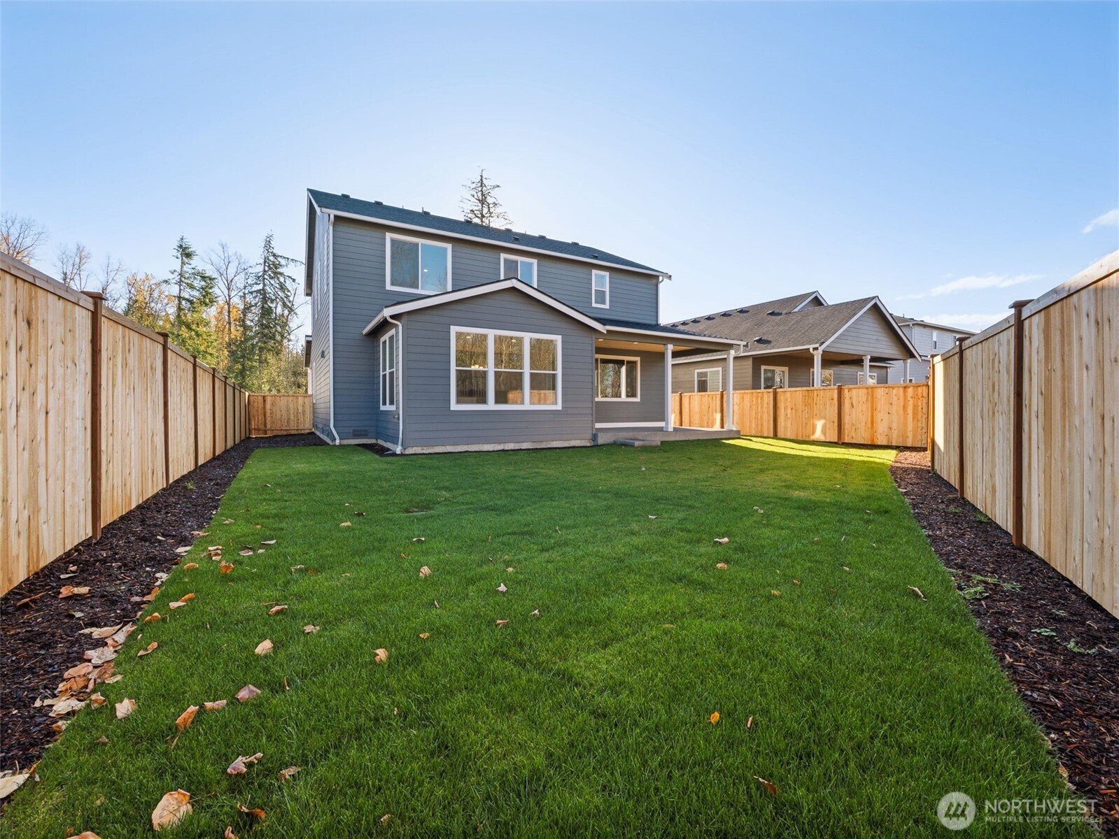 1132 Tanner Avenue, Unit 111 Buckley, WA 98321 - Photo 16 of 17 a front view of a house with garden