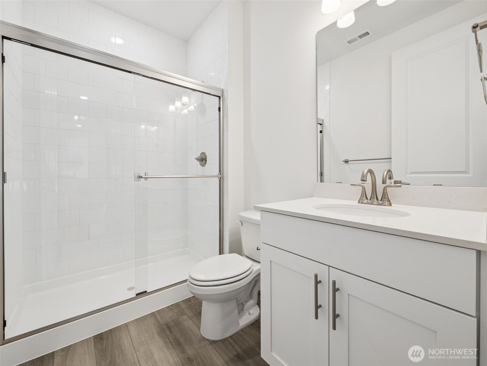 1132 Tanner Avenue, Unit 111 Buckley, WA 98321 - Photo 8 of 17 a bathroom with a sink a toilet and shower