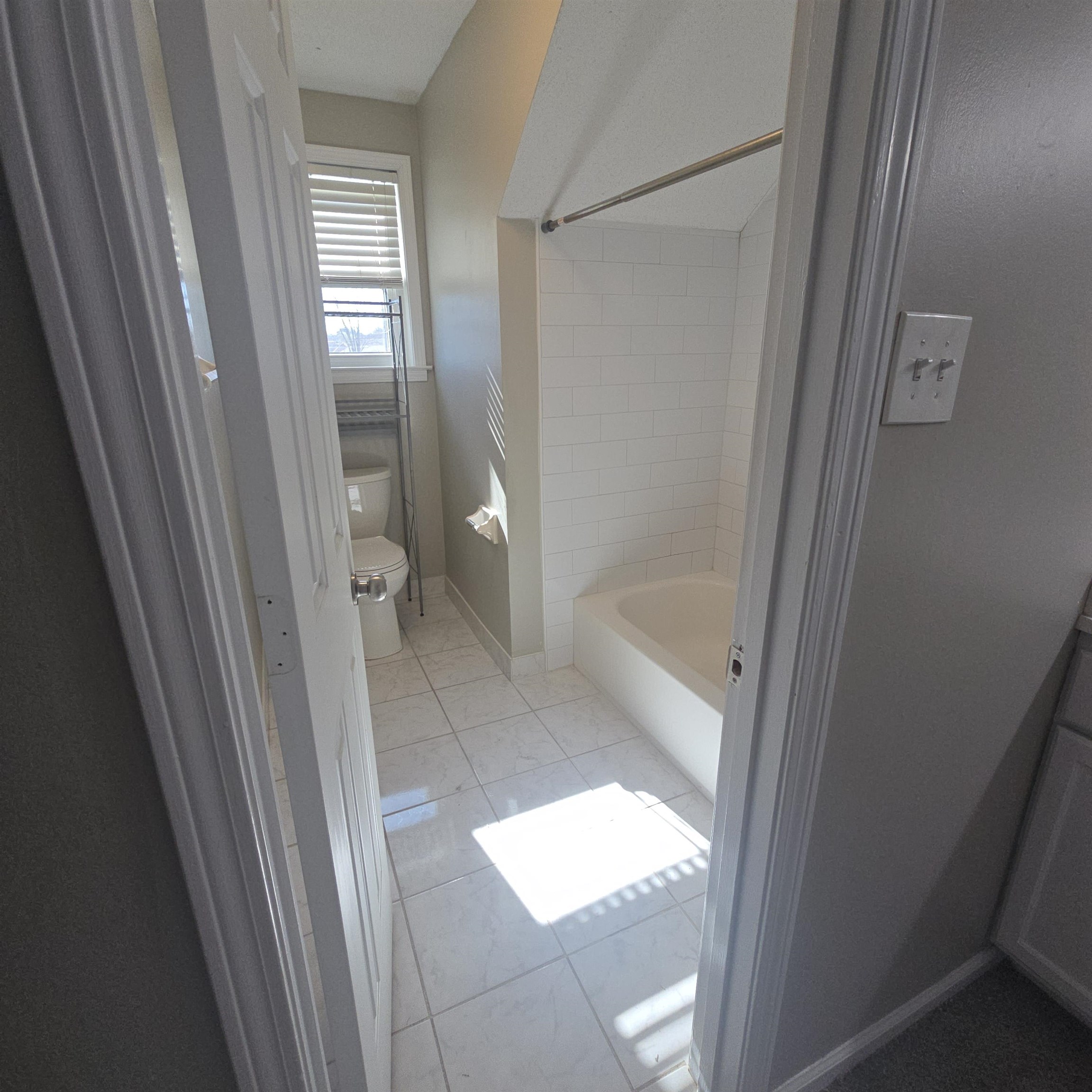 2317 Belin Drive Memphis, TN 38133 - Photo 11 of 14 a bathroom with a glass door shower and toilet