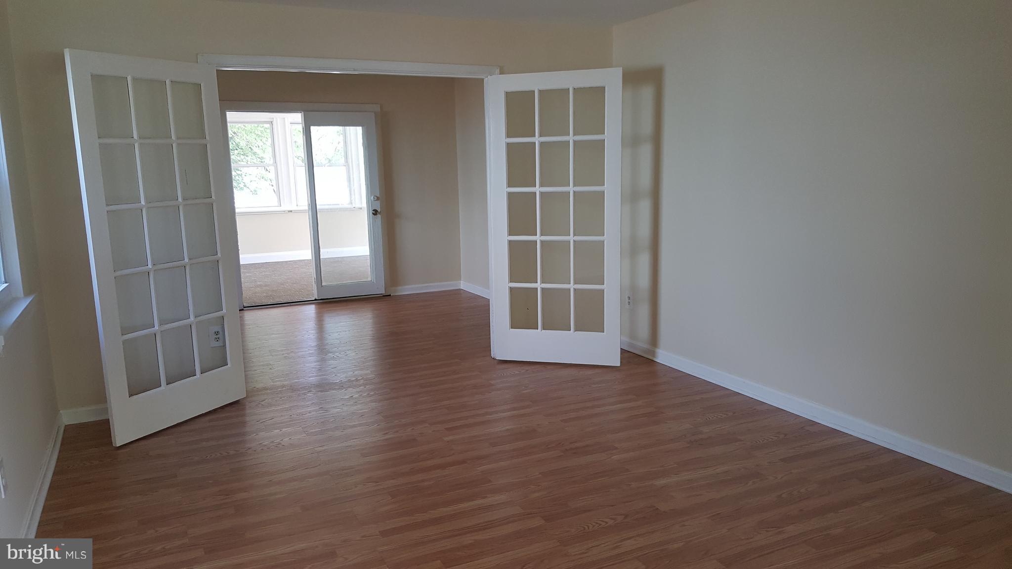 302 South Harrison Road Sterling, VA 20164 - Photo 4 of 24 Living Room opens to den, then sun room