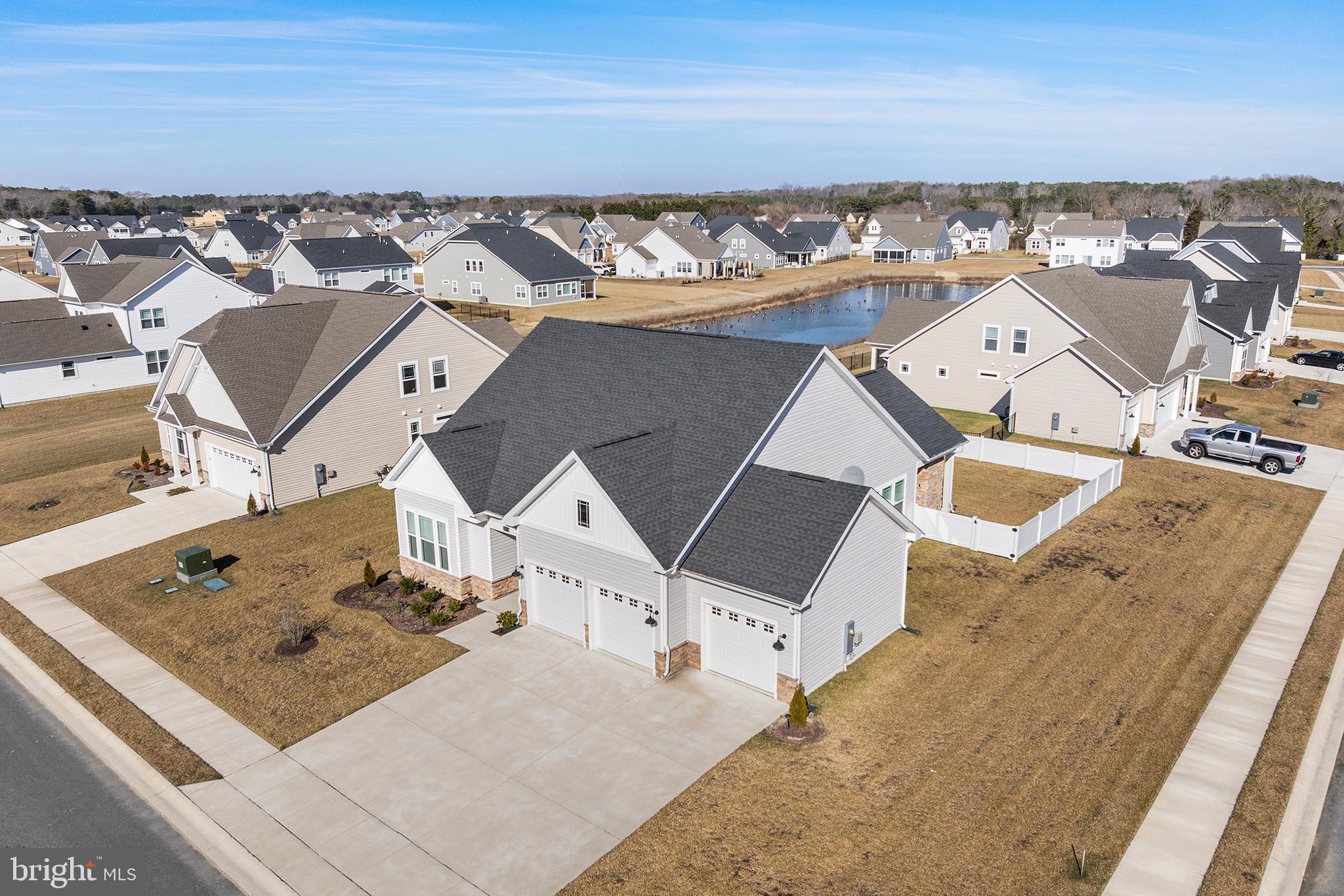 an aerial view of a house with a ocean view