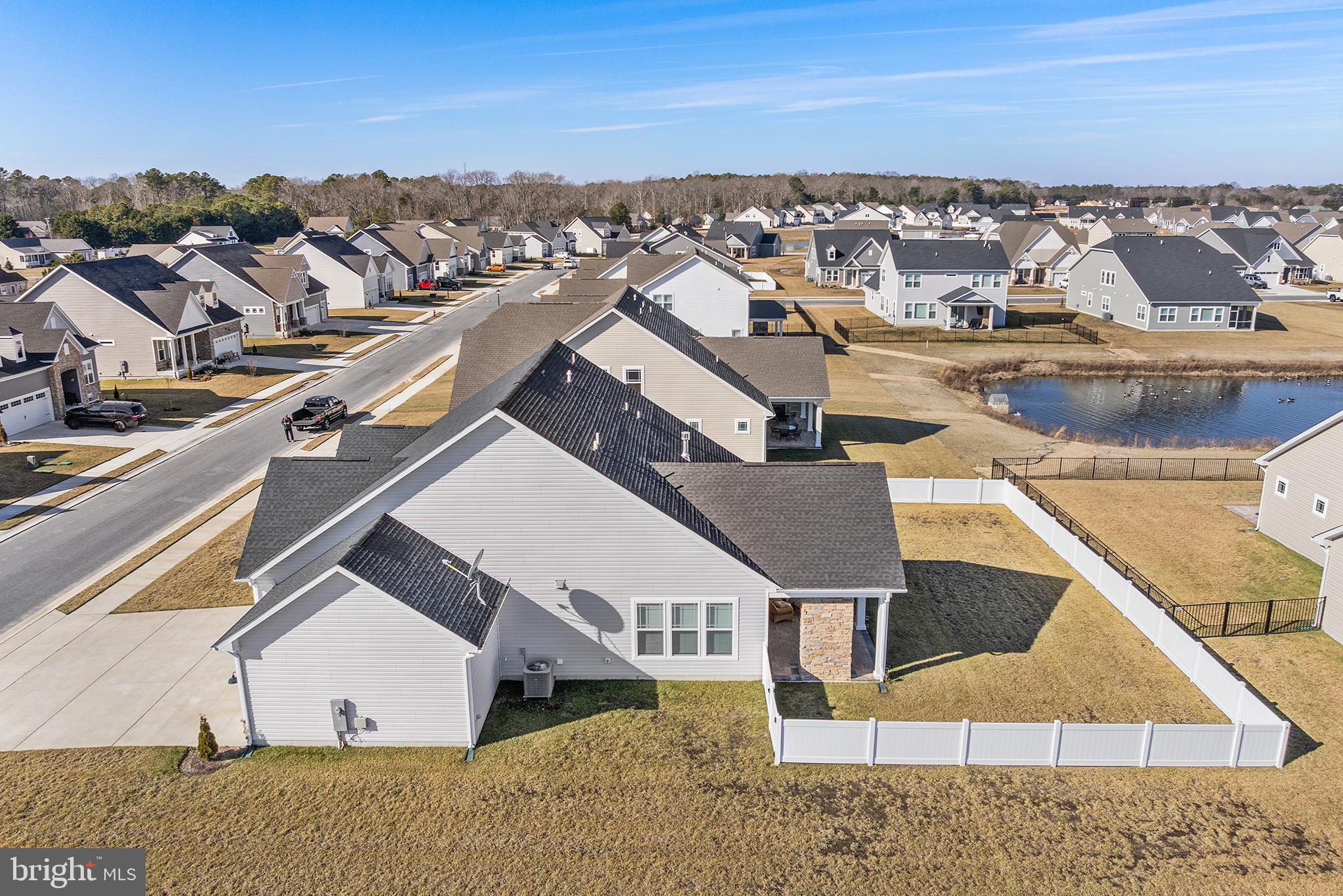 29255 Baker Island Road Lewes, DE 19958 - Photo 2 of 56 an aerial view of residential houses with outdoor space