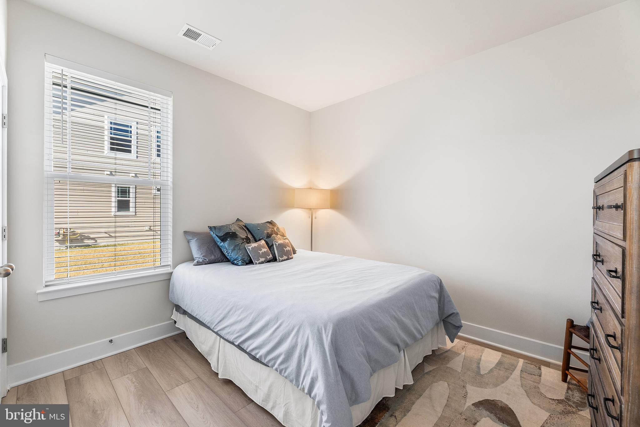 29255 Baker Island Road Lewes, DE 19958 - Photo 34 of 56 a bedroom with a bed and a window