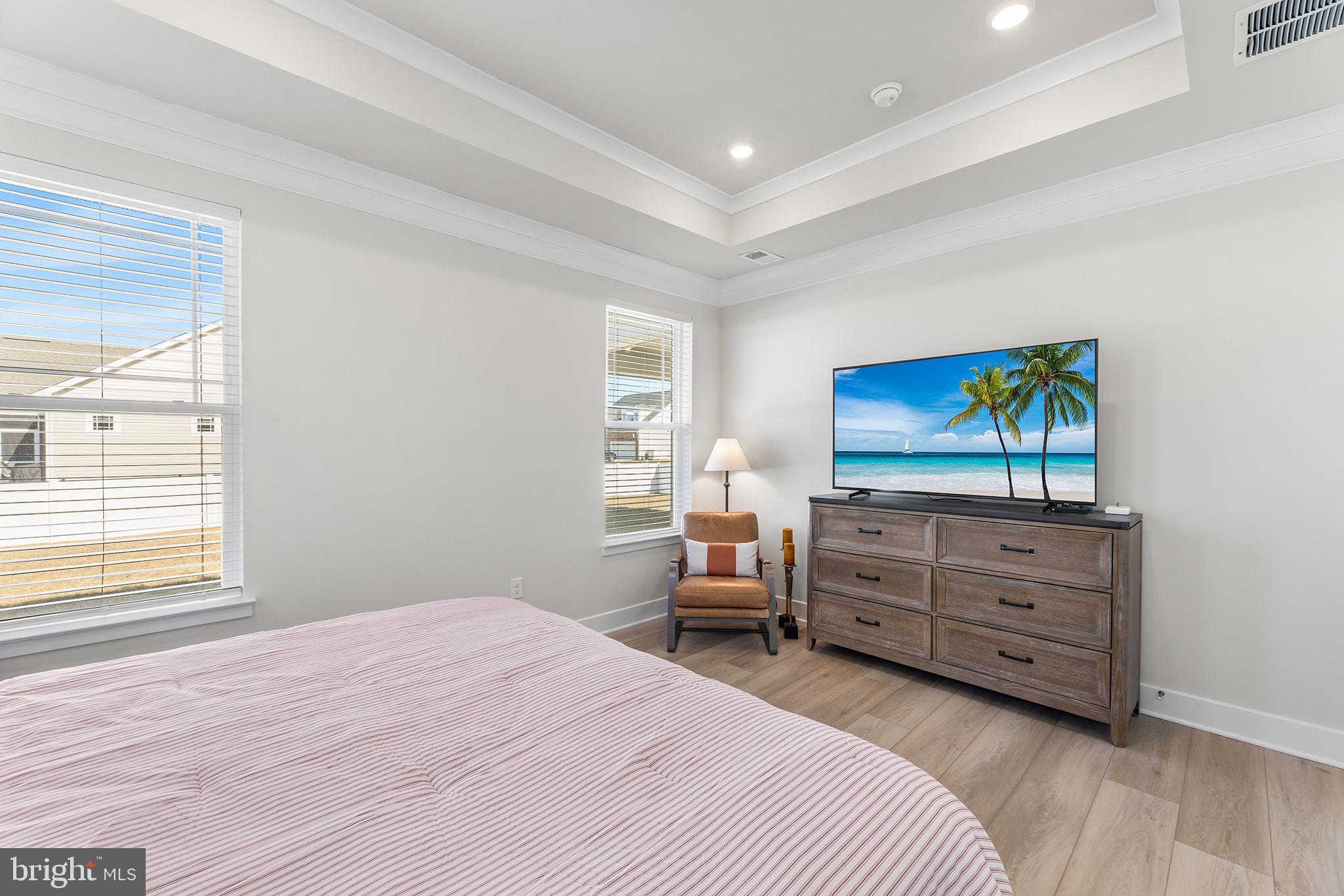 29255 Baker Island Road Lewes, DE 19958 - Photo 39 of 56 a bedroom with a bed and furniture