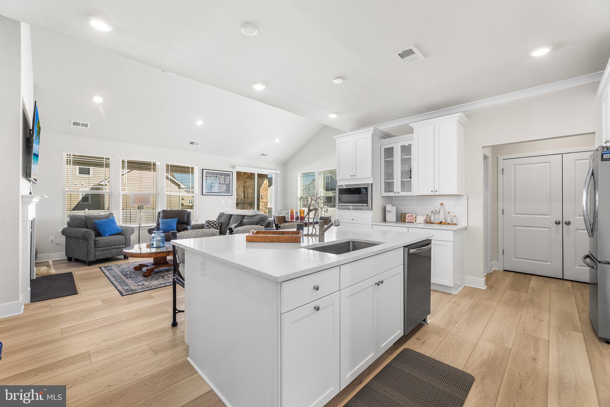 29255 Baker Island Road Lewes, DE 19958 - Photo 5 of 56 a view of kitchen with sink wooden floor and living room