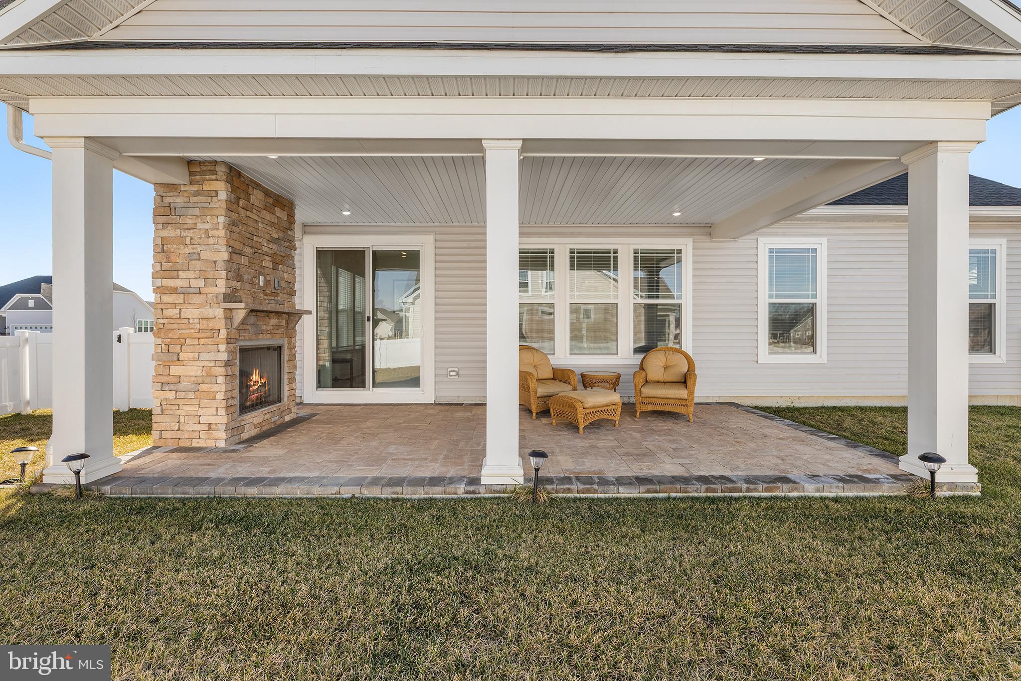 29255 Baker Island Road Lewes, DE 19958 - Photo 51 of 56 Charming patio with cozy stone fireplace.