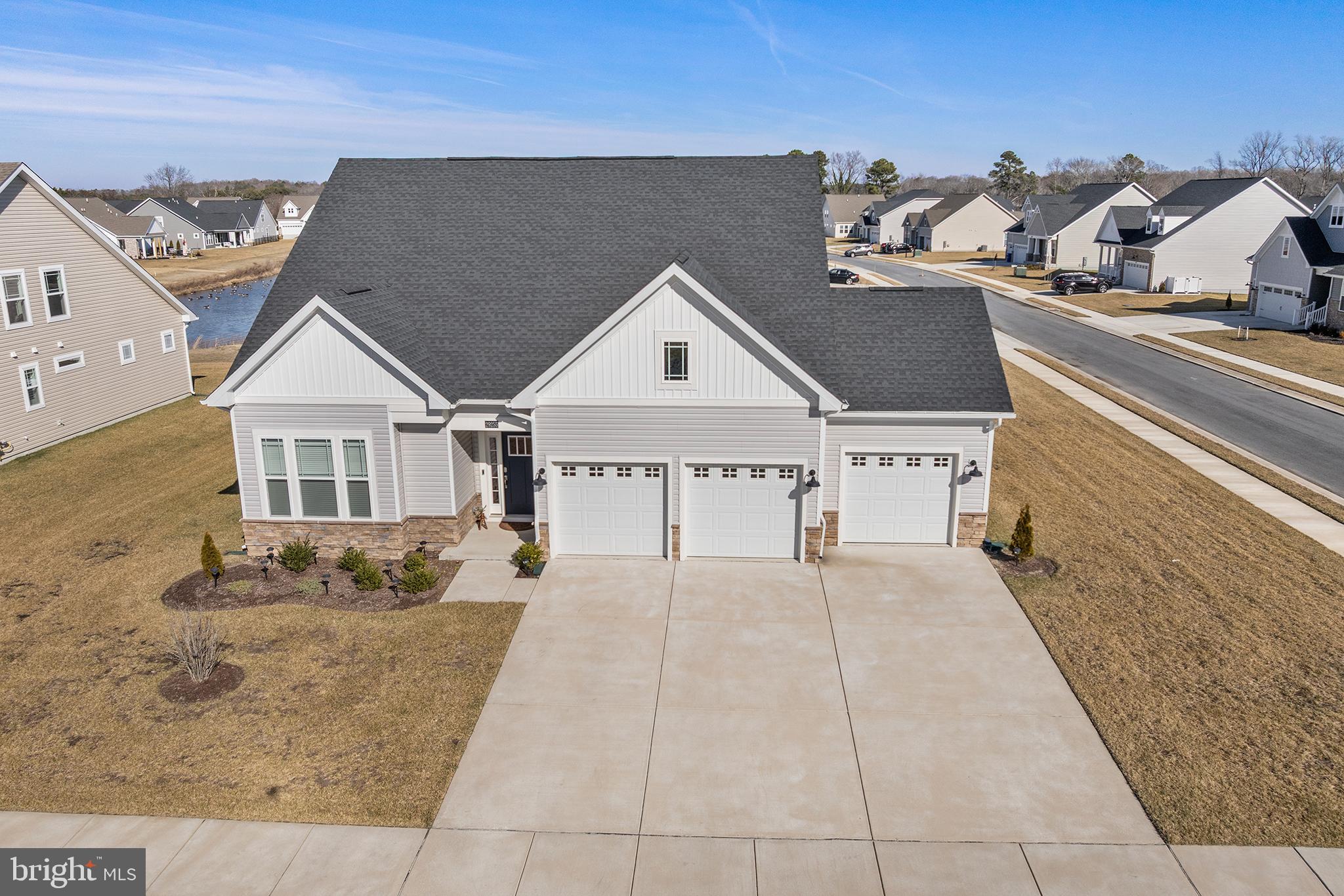29255 Baker Island Road Lewes, DE 19958 - Photo 53 of 56 a view of a house with a terrace