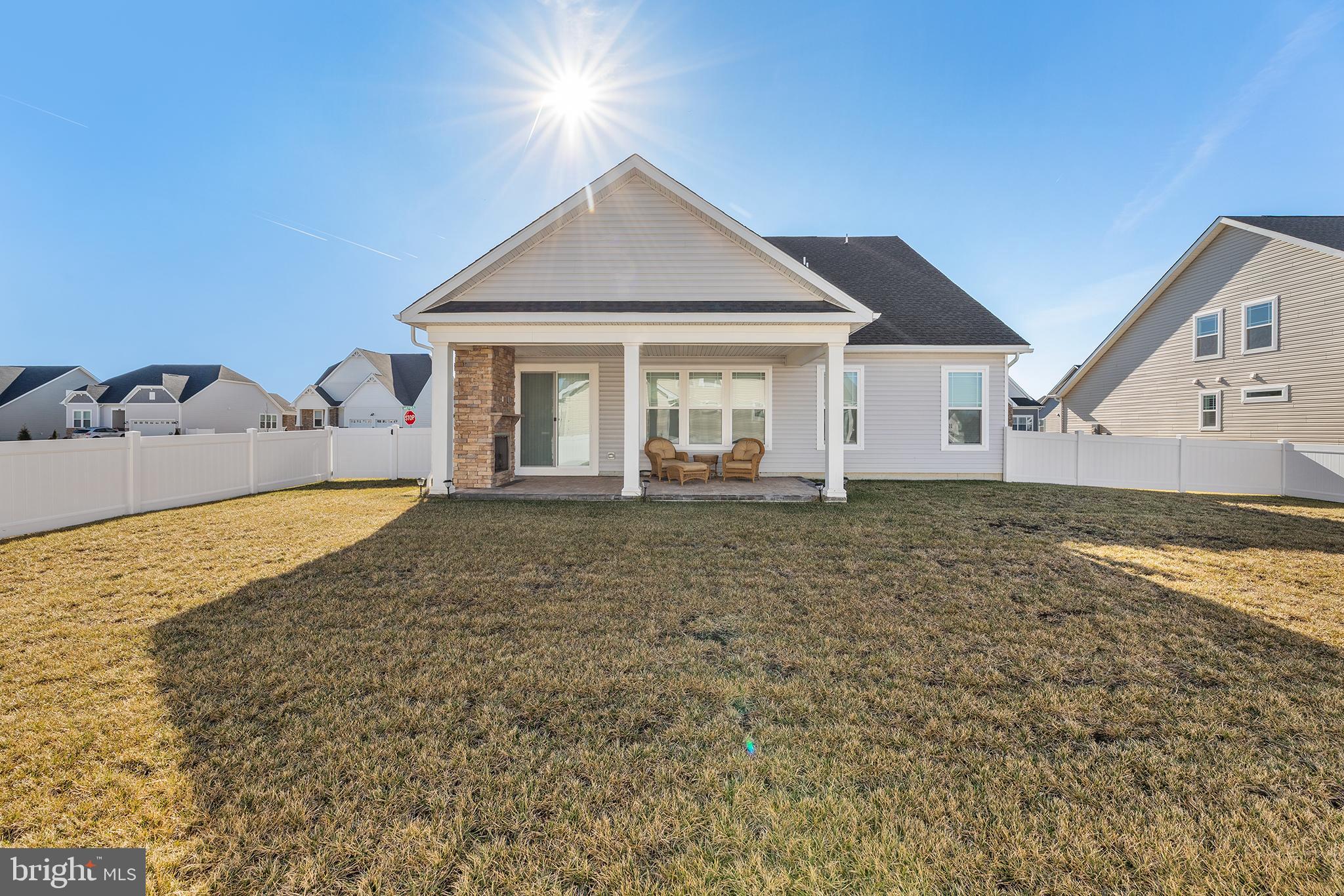 29255 Baker Island Road Lewes, DE 19958 - Photo 54 of 56 a view of a house with a backyard