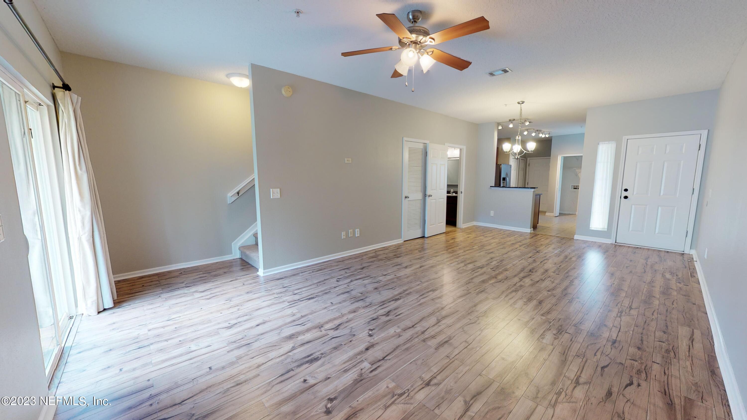 168 Leese Drive St. Johns, FL 32259 - Photo 11 of 25 wooden floor in an empty room with a window