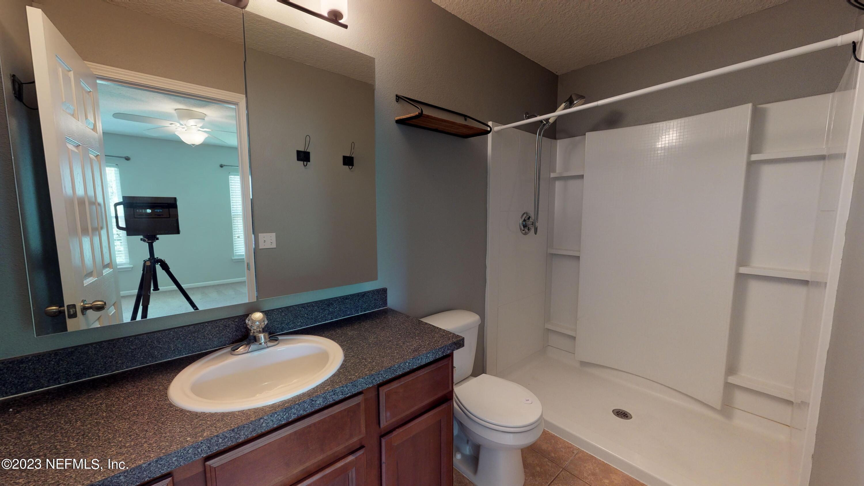 168 Leese Drive St. Johns, FL 32259 - Photo 14 of 25 a bathroom with a sink vanity granite toilet and shower