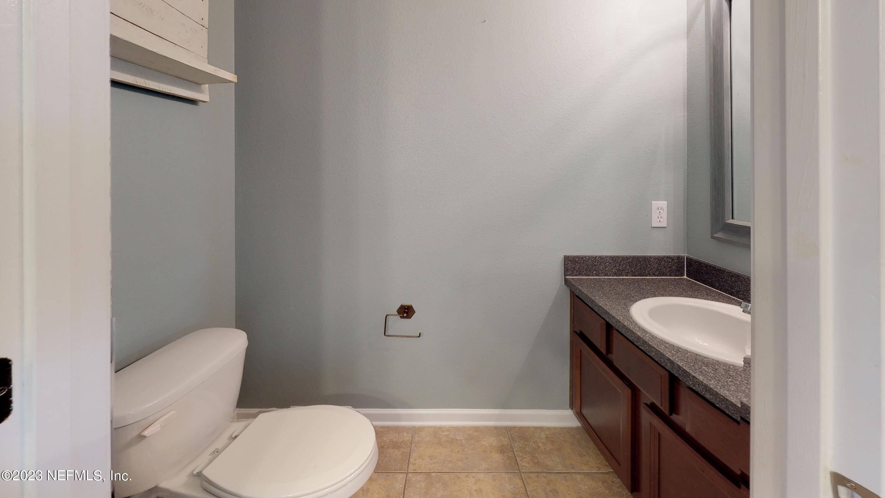 168 Leese Drive St. Johns, FL 32259 - Photo 19 of 25 a bathroom with a toilet sink and mirror