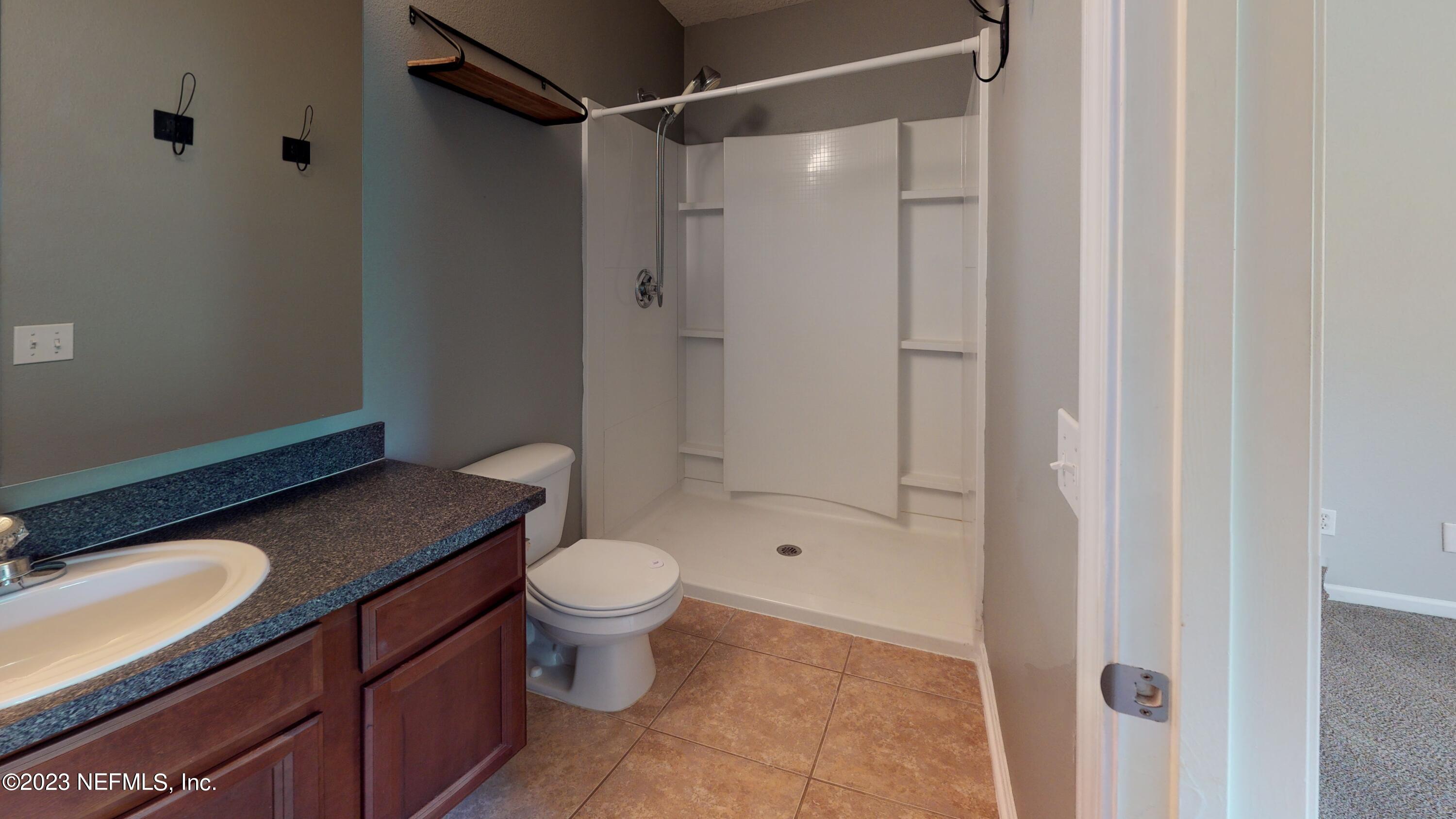 168 Leese Drive St. Johns, FL 32259 - Photo 20 of 25 a bathroom with a granite countertop sink toilet and shower