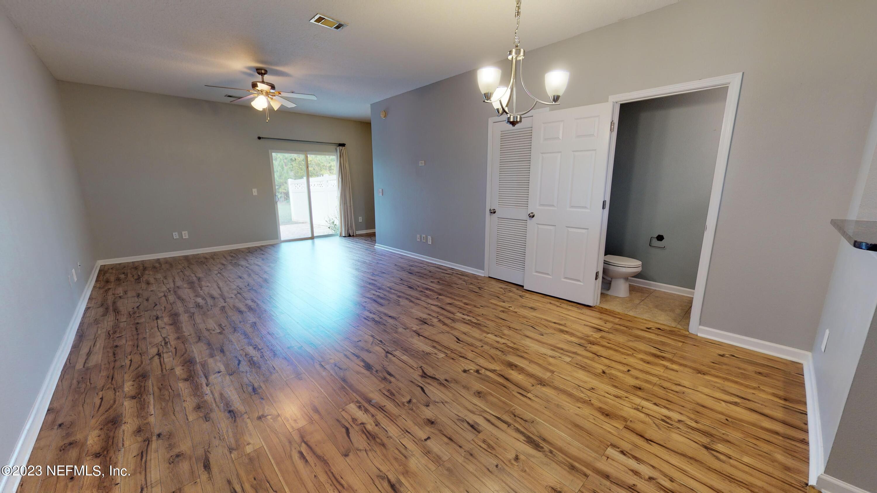 168 Leese Drive St. Johns, FL 32259 - Photo 2 of 25 wooden floor in an empty room with a mirror