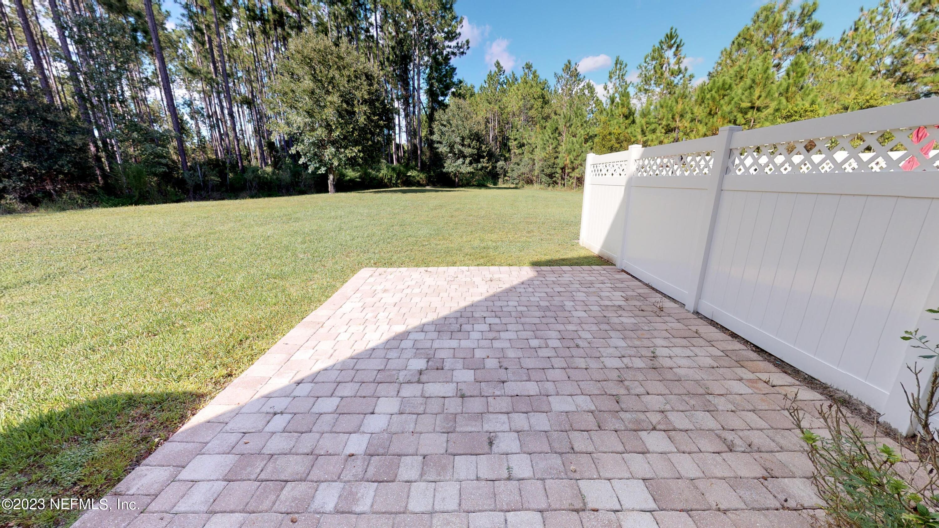 168 Leese Drive St. Johns, FL 32259 - Photo 22 of 25 a view of a yard with potted plants