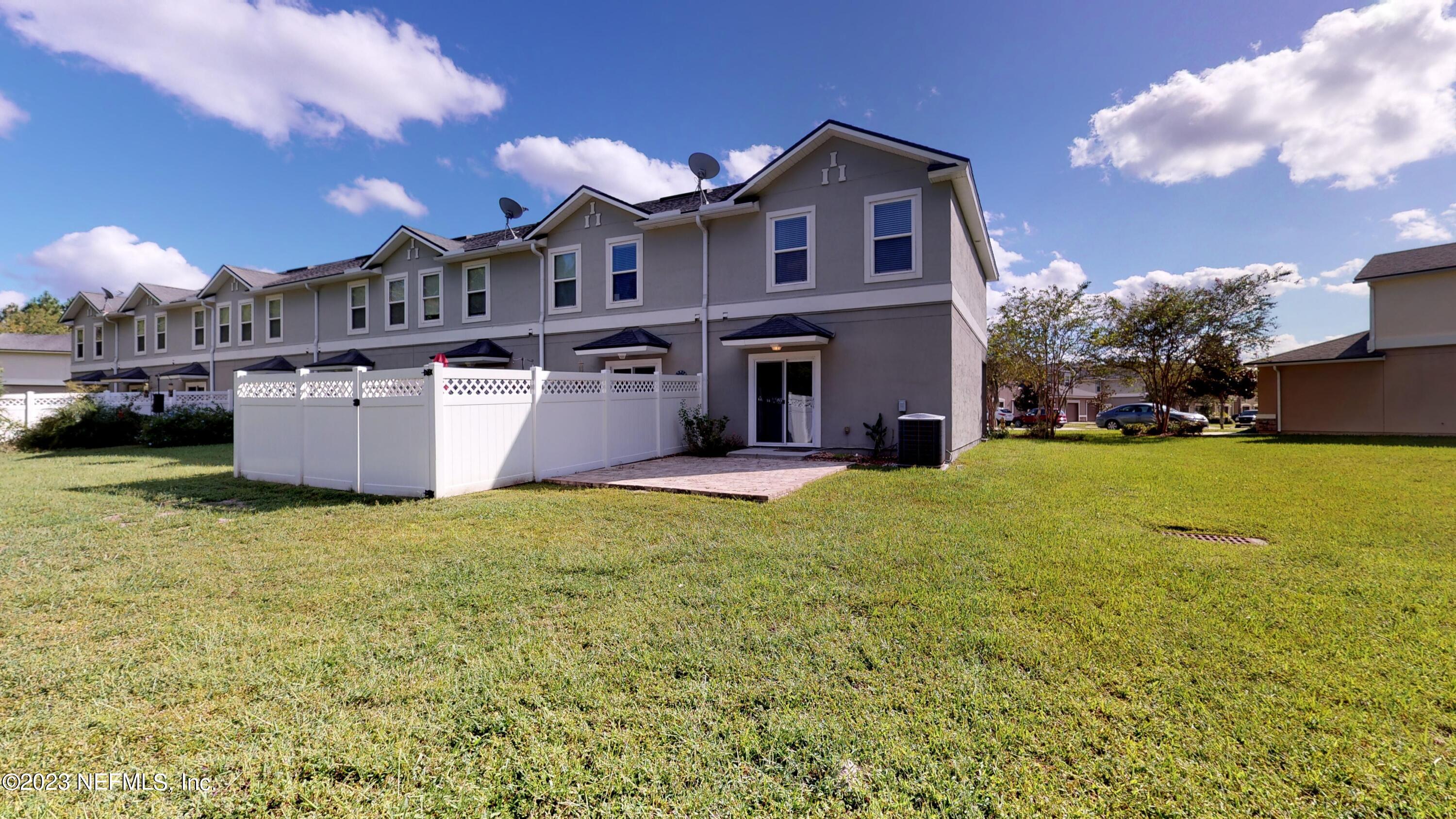 168 Leese Drive St. Johns, FL 32259 - Photo 23 of 25 a view of a house with a yard and garage