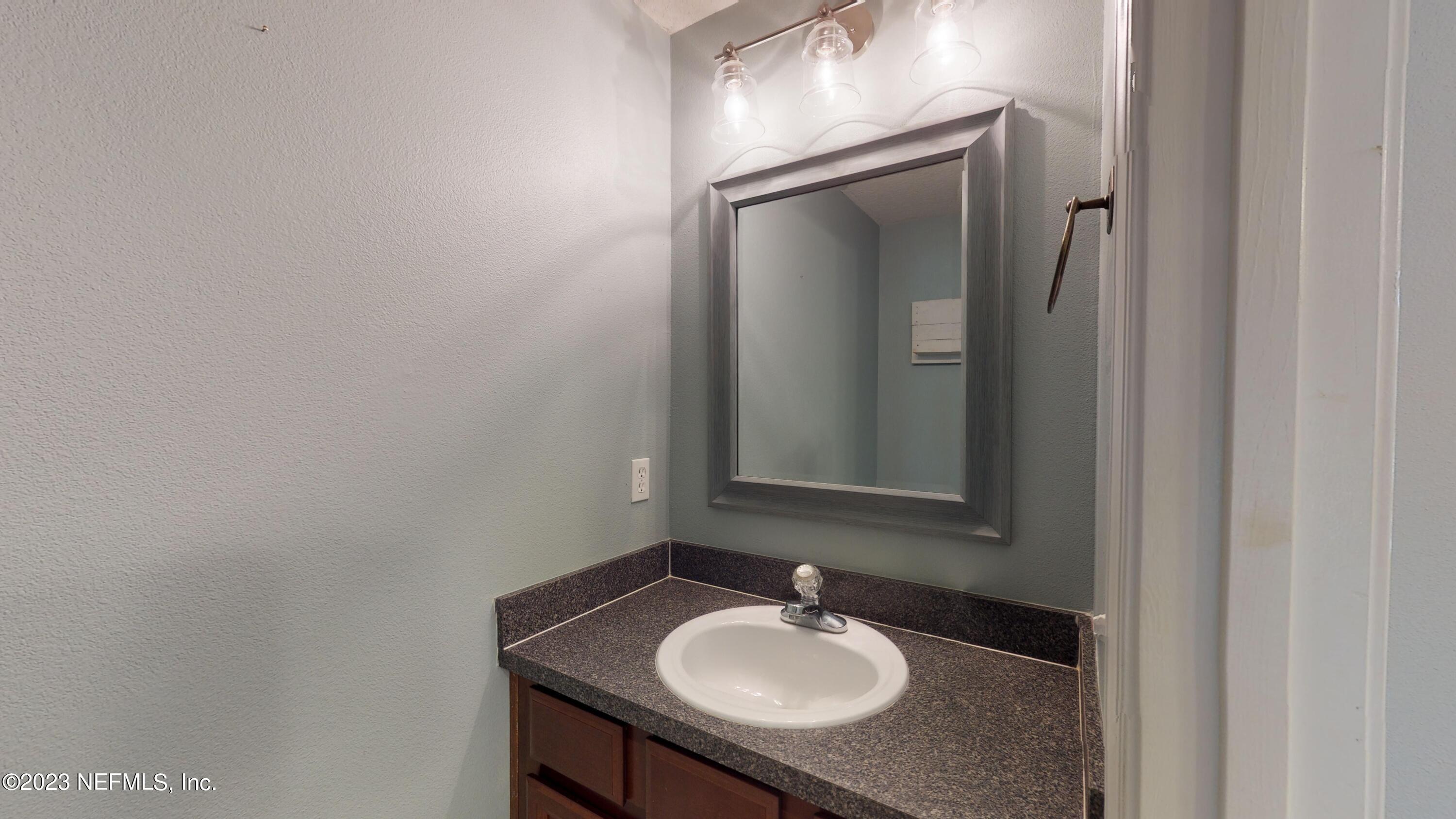 168 Leese Drive St. Johns, FL 32259 - Photo 10 of 25 a bathroom with a sink and a mirror
