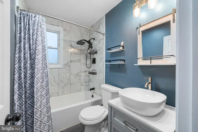 a bathroom with a toilet a sink and a bathtub