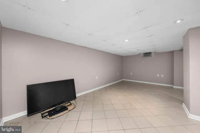 a view of an empty room with a flat screen tv