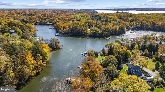 a living room with furniture fireplace and a table
