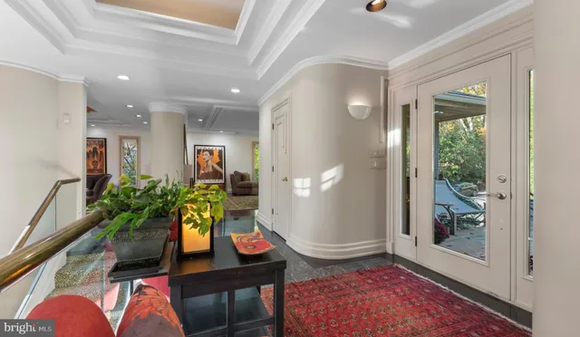 a kitchen with stainless steel appliances granite countertop a refrigerator sink and white cabinets
