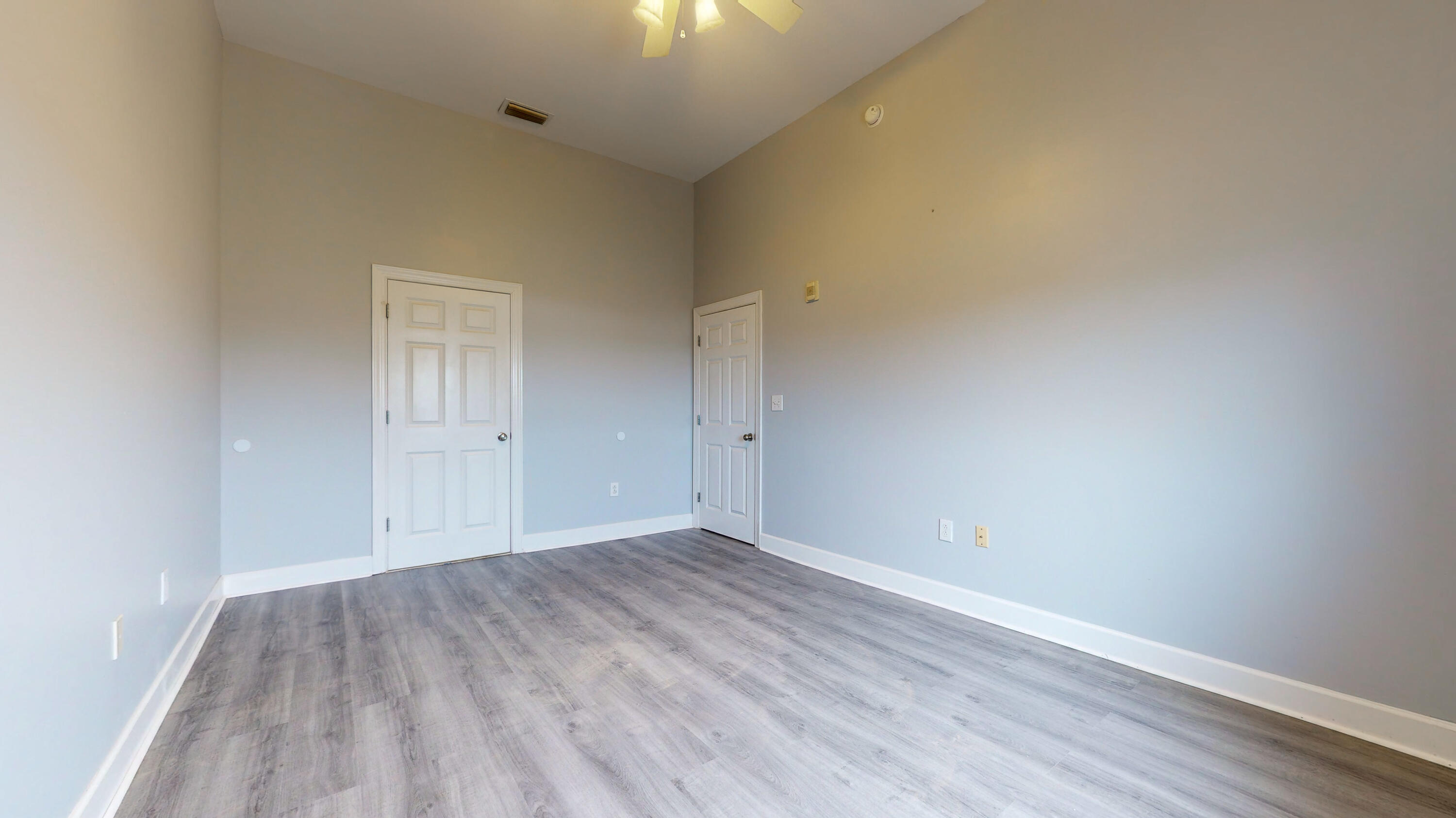 231 Somerset Bridge Road, Unit 1408 Santa Rosa Beach, FL 32459 - Photo 18 of 25 a view of an empty room with wooden floor