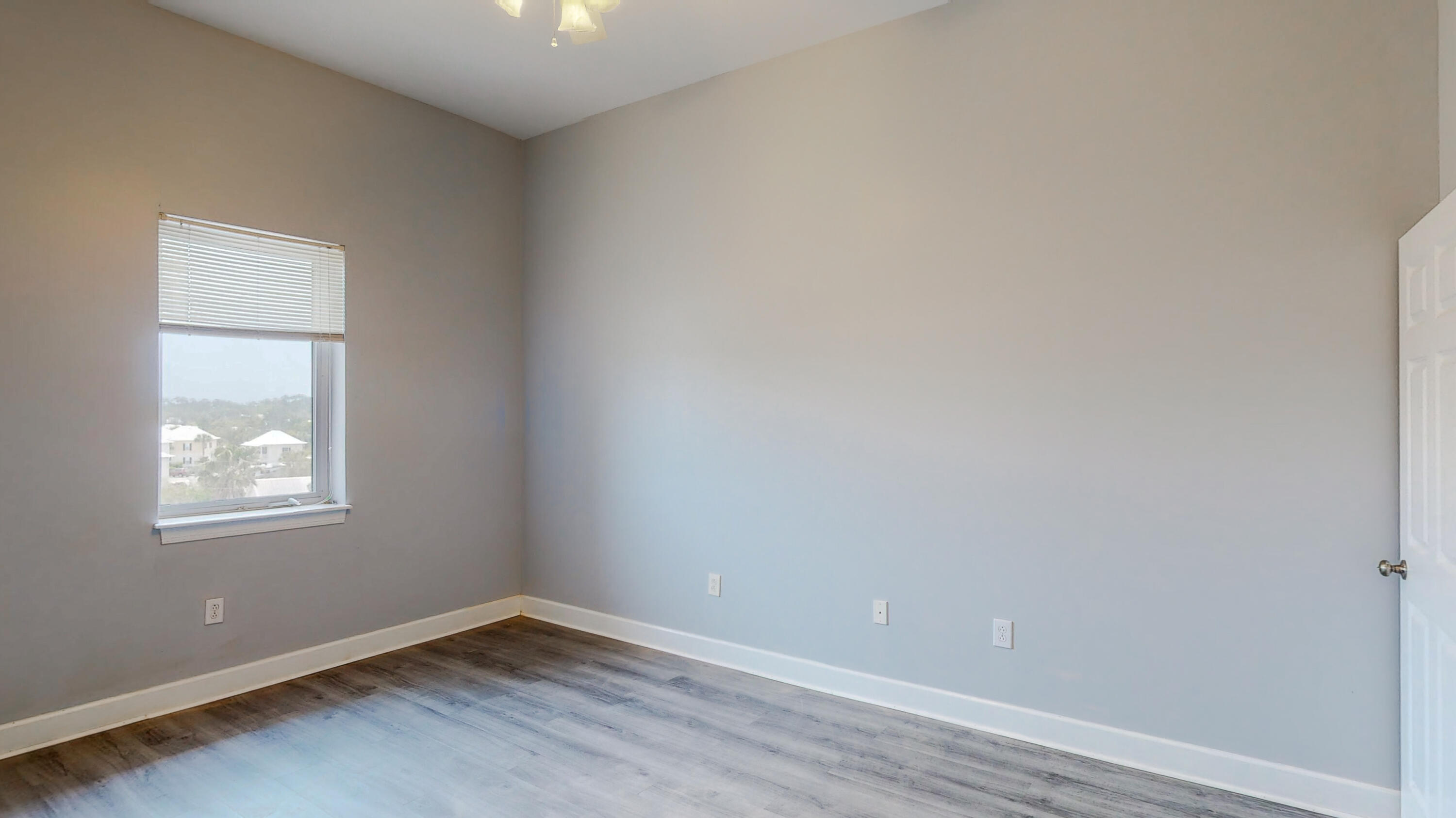 231 Somerset Bridge Road, Unit 1408 Santa Rosa Beach, FL 32459 - Photo 22 of 25 an empty room with windows
