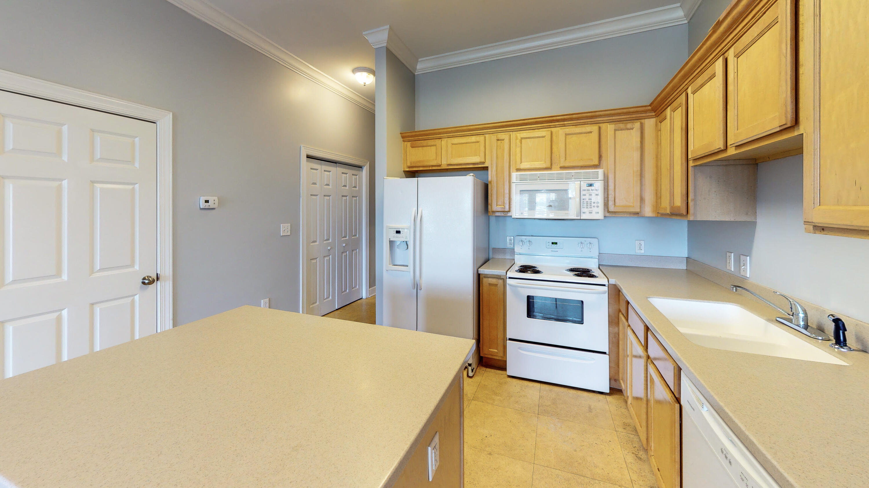 231 Somerset Bridge Road, Unit 1408 Santa Rosa Beach, FL 32459 - Photo 8 of 25 a kitchen with a stove a sink and a refrigerator