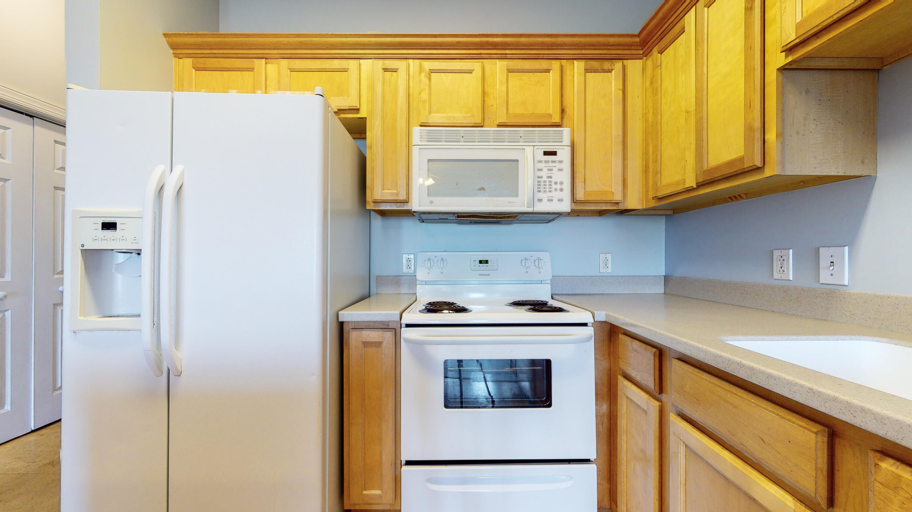 231 Somerset Bridge Road, Unit 1408 Santa Rosa Beach, FL 32459 - Photo 9 of 25 a kitchen with stainless steel appliances granite countertop a refrigerator and a sink