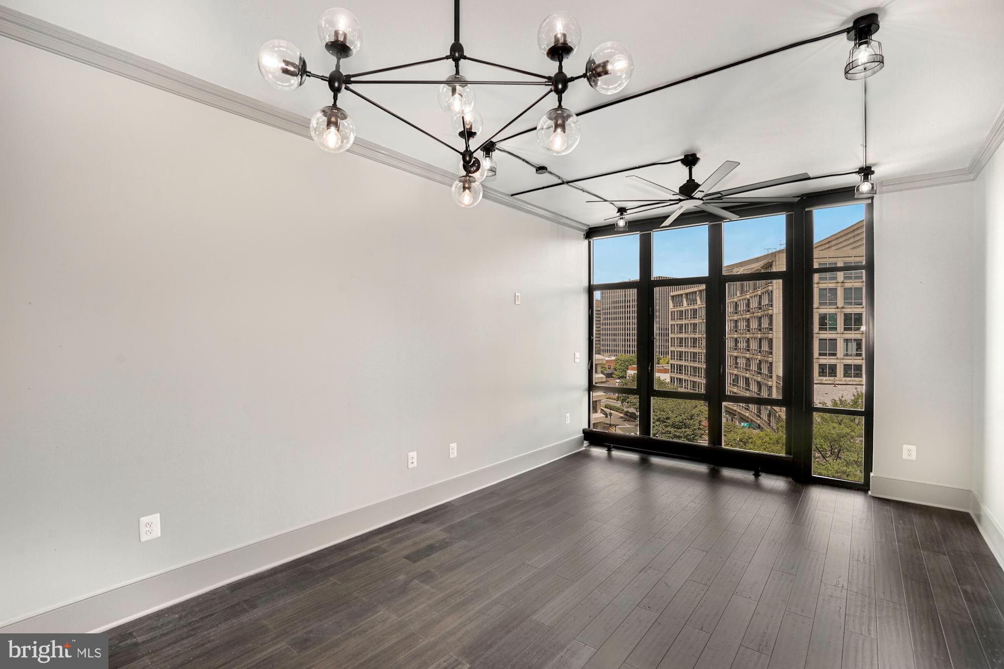 4301 Military Road Northwest, Unit 611 Washington, DC 20015 - Photo 18 of 45 Living Room with wall of floor to ceiling windows