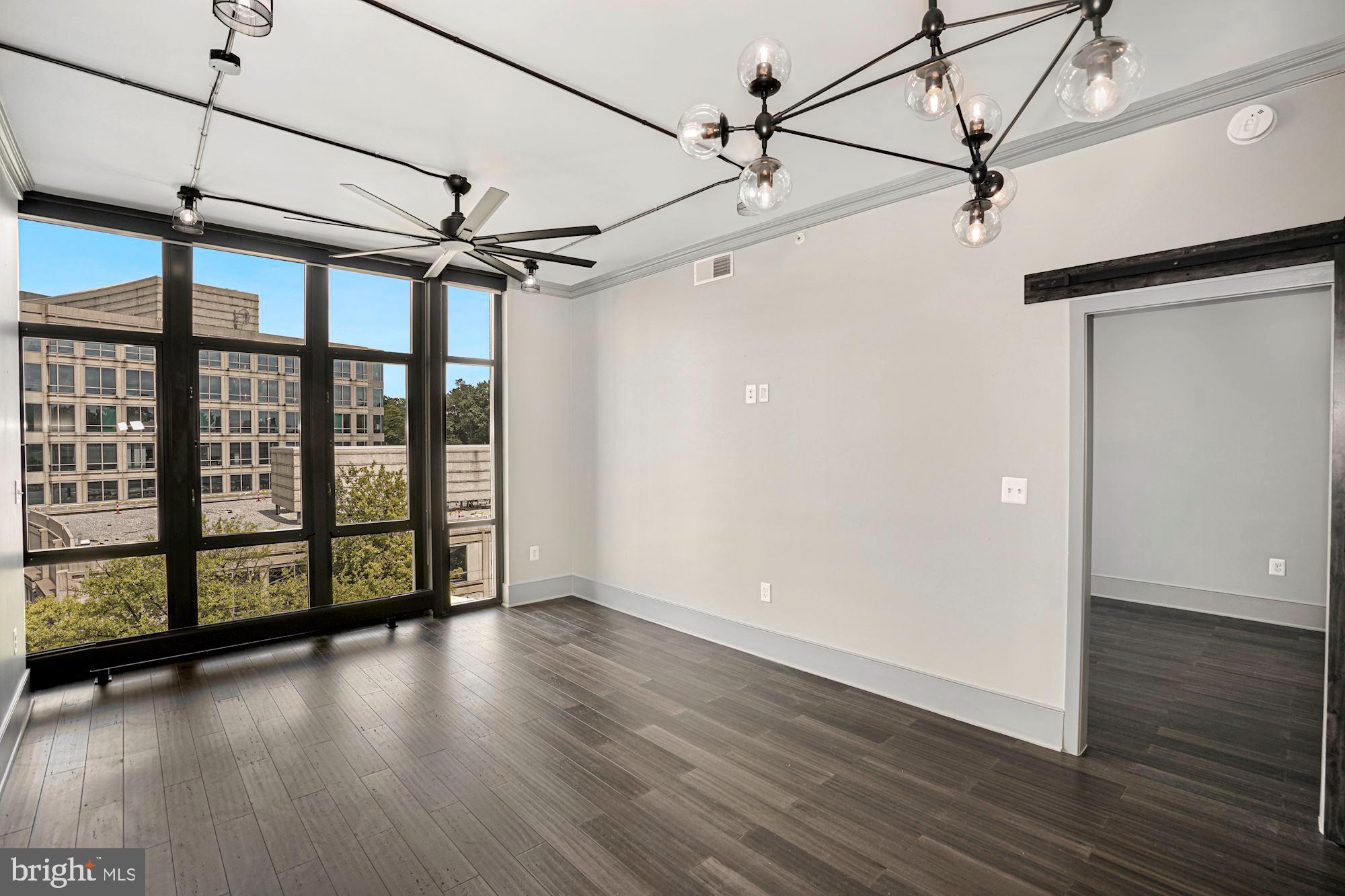 4301 Military Road Northwest, Unit 611 Washington, DC 20015 - Photo 19 of 45 Living Room with wall of floor to ceiling windows