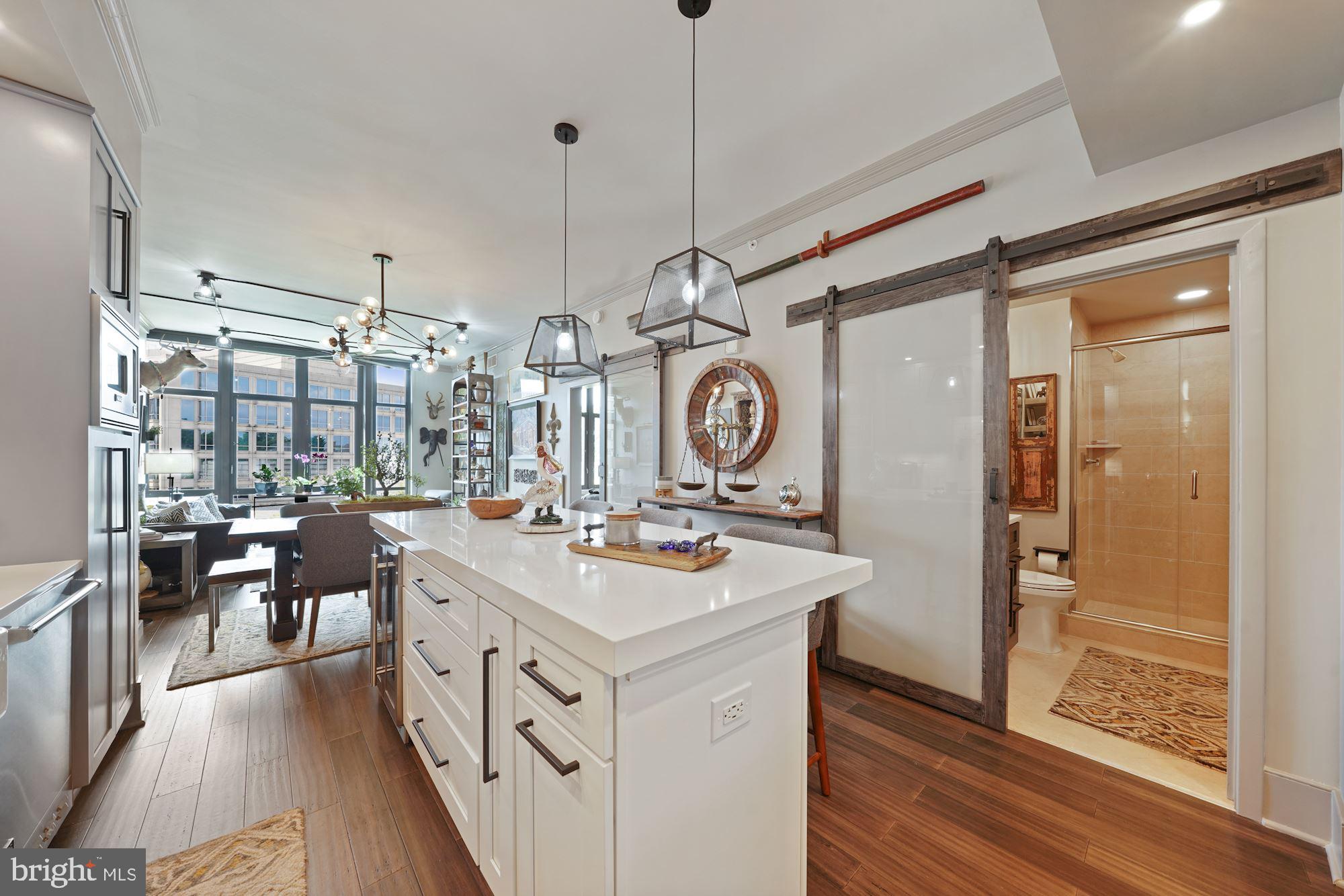 4301 Military Road Northwest, Unit 611 Washington, DC 20015 - Photo 9 of 45 Kitchen looking into dining and living space