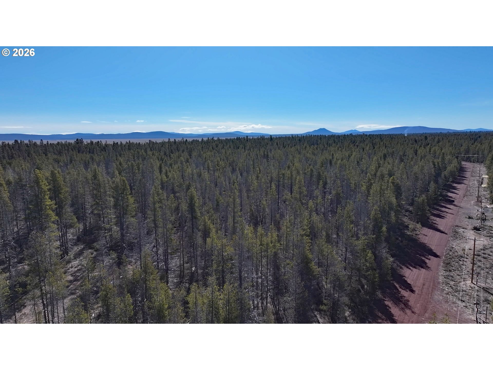 Scott View Drive, Unit 11 Chiloquin, OR 97624 - Photo 6 of 37 a black and white photo of a house in a field