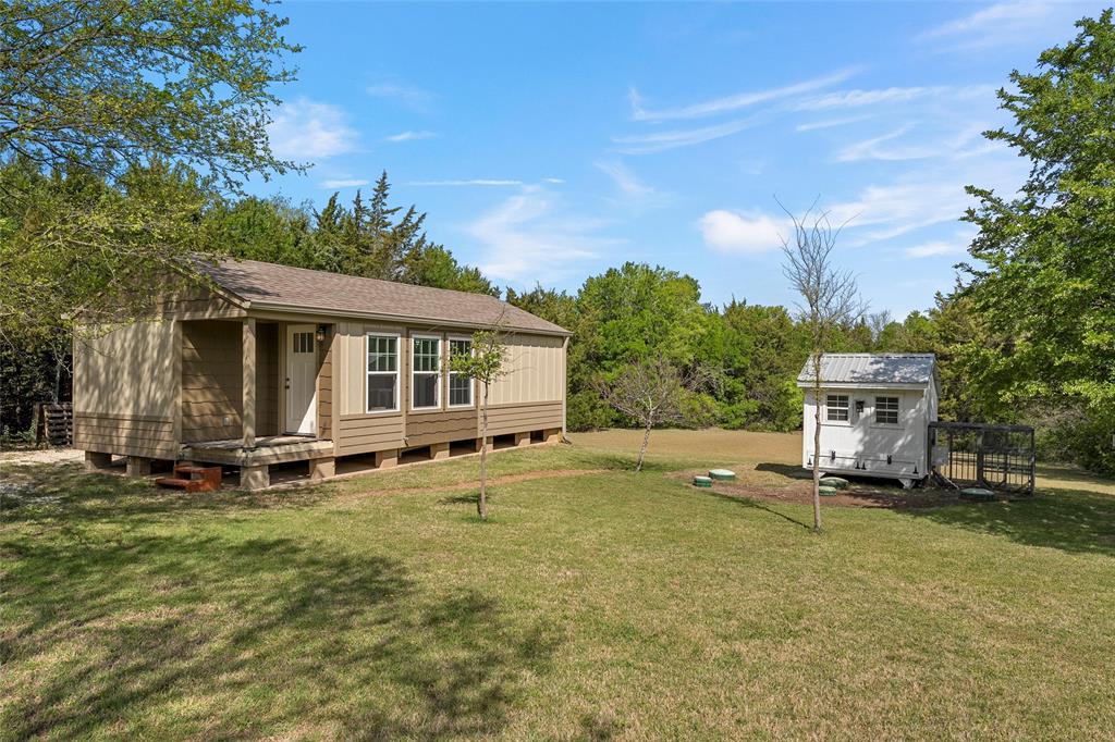 14690 Chapel Road Lorena, TX 76655 - Photo 39 of 40 a view of a house with a yard and sitting area