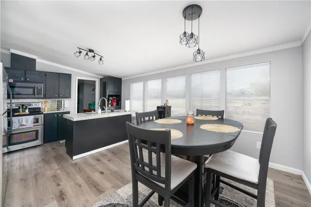 a view of a dining room with furniture window and wooden floor