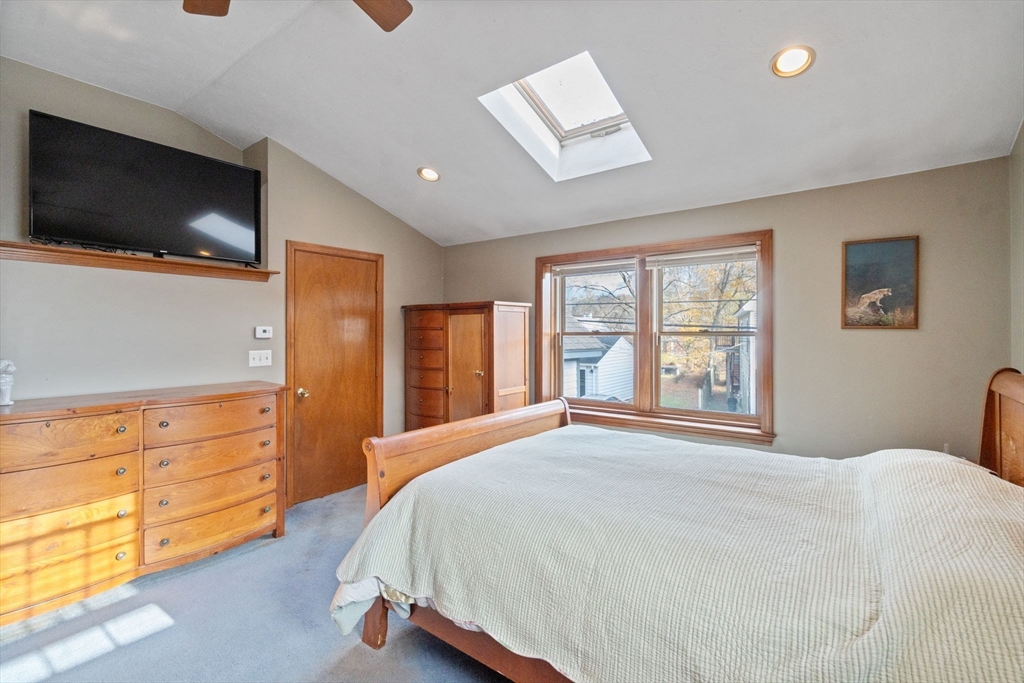 37 Glendale Street Maynard, MA 01754 - Photo 17 of 33 a bedroom with a bed and flat screen tv