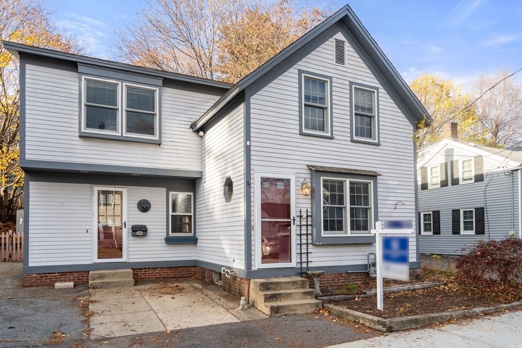 37 Glendale Street Maynard, MA 01754 - Photo 2 of 33 a front view of a house with a garage