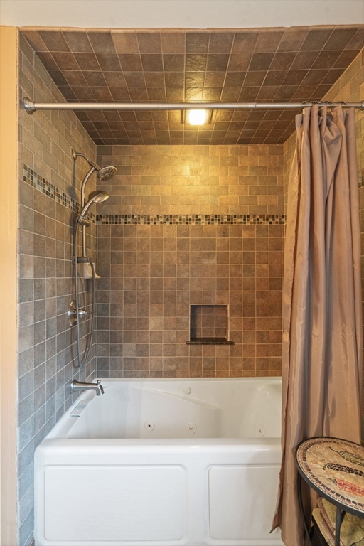 37 Glendale Street Maynard, MA 01754 - Photo 23 of 33 a bathroom with a shower and a tub