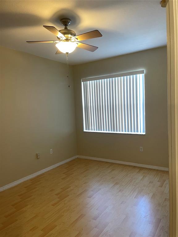 3389 Merrick Court, Unit 3389 Pompano Beach, FL 33063 - Photo 4 of 23 a view of an empty room with a window