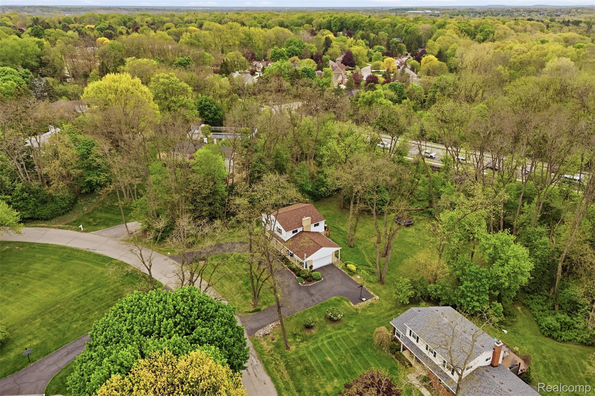 47129 Dunsany Road Northville, MI 48167 - Photo 43 of 49 Bird's eye view of a heavily wooded area