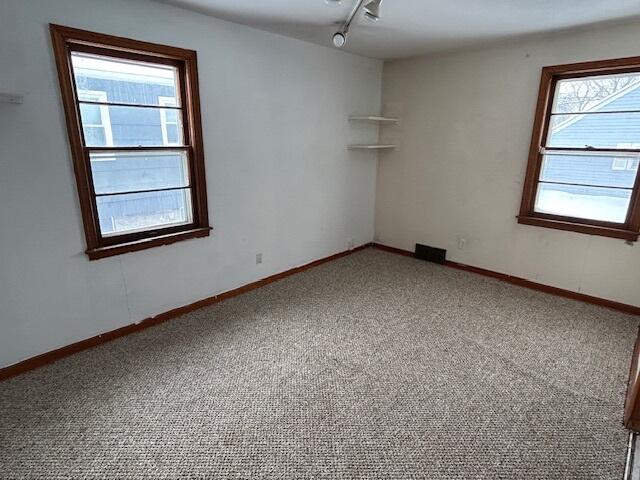 17946 Roy Street Lansing, IL 60438 - Photo 12 of 17 an empty room with windows and closet