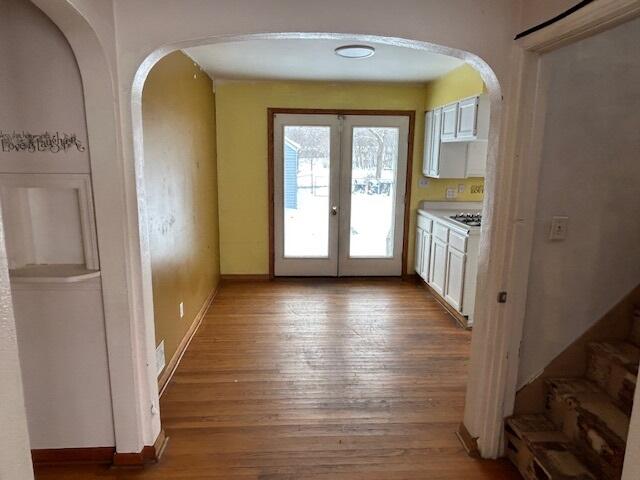 17946 Roy Street Lansing, IL 60438 - Photo 6 of 17 a view of a hallway with wooden floor and a living room
