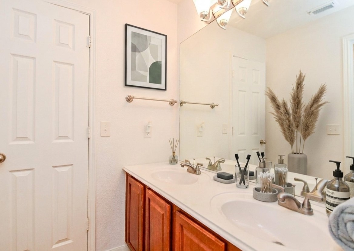 19802 Shavon Springs Drive Spring, TX 77388 - Photo 26 of 30 This elegant bathroom features a double vanity, ample storage, and a stylish design that creates a serene, spa-like atmosphere. Virtually staged