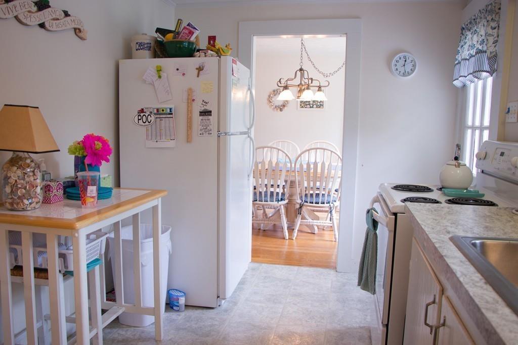 985 Shore Road Bourne, MA 02559 - Photo 10 of 27 a kitchen with stainless steel appliances granite countertop a refrigerator and a sink