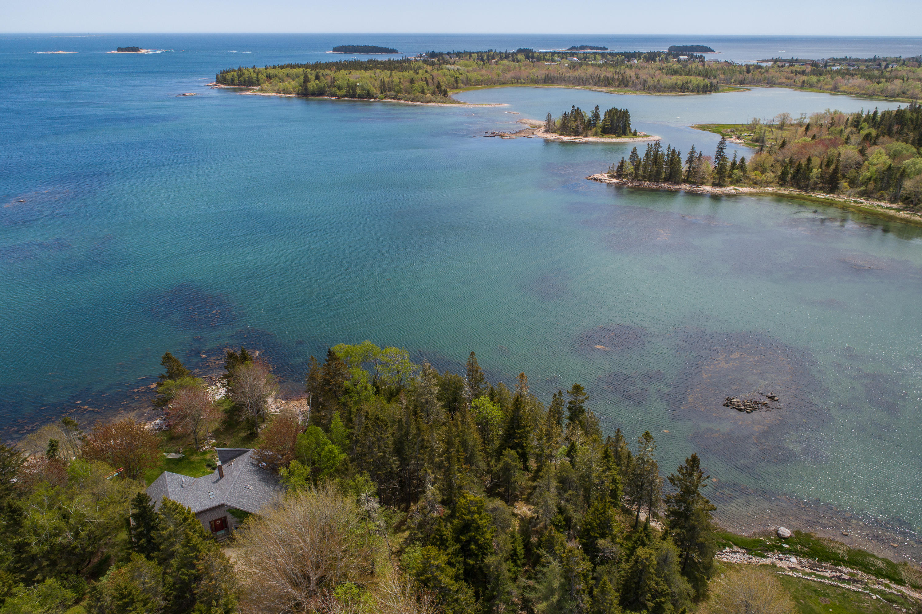 127 Paul Bunyan Road Corea, ME 04624 - Photo 2 of 46 Aerial of the house and point to ocean.