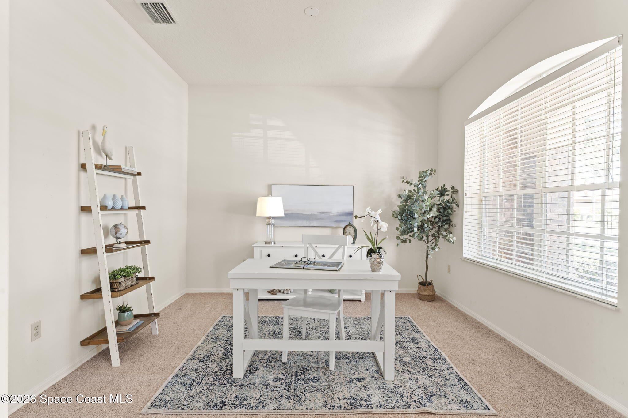 1123 Spring Oak Drive Melbourne, FL 32901 - Photo 11 of 67 a dining room with furniture and a window