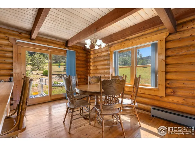 a view of a living room and dining room
